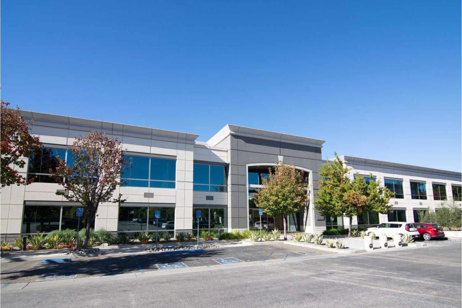 Facility front with entrance and accessible parking.