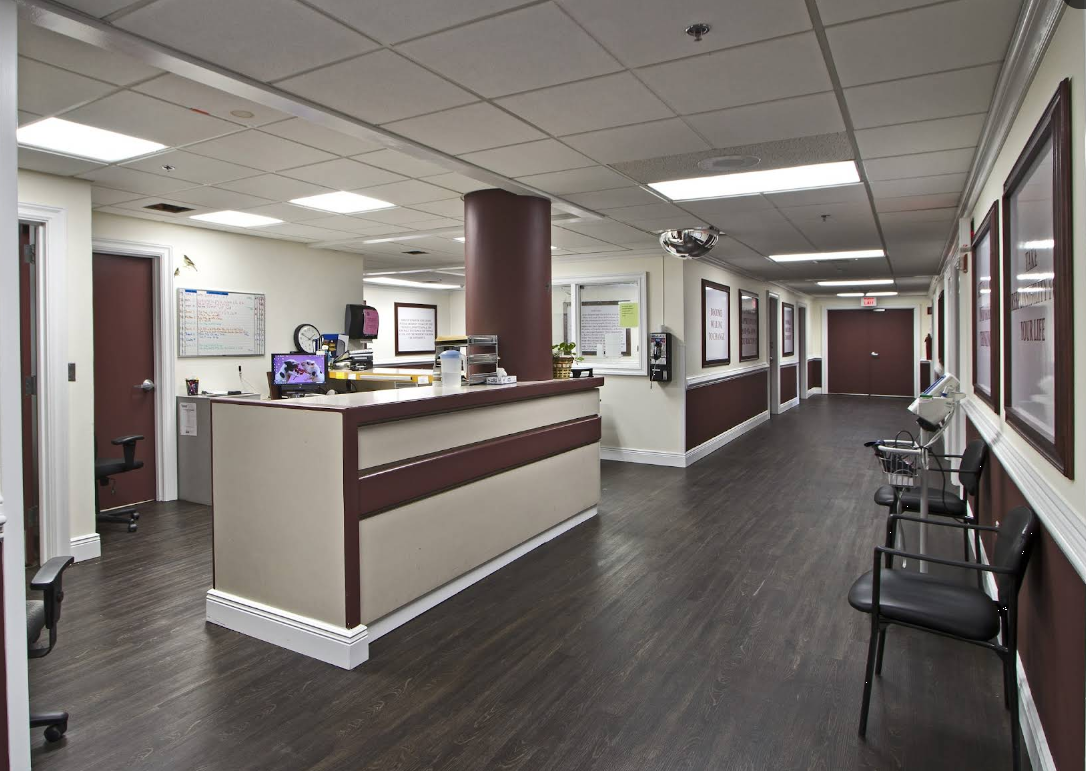 Reception desk and hallway inside rehab center