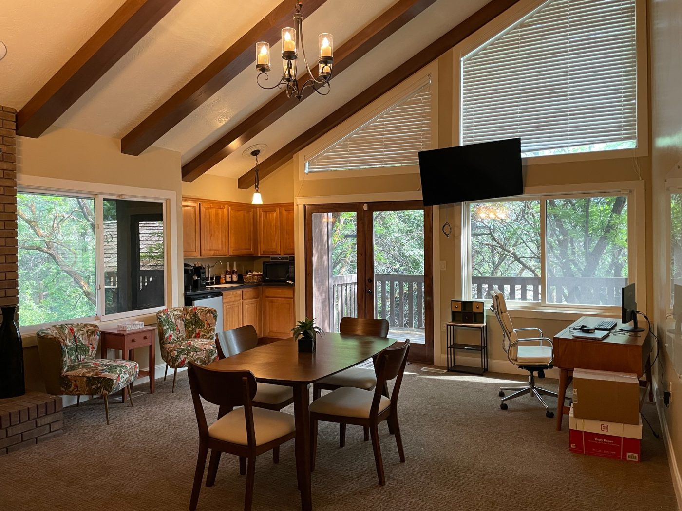 Meeting space with table, chairs, and kitchenette