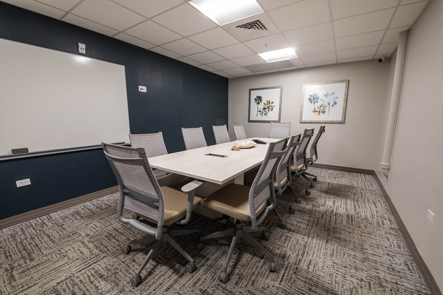 Group counseling room with chairs, windows, and whiteboard