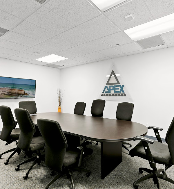 Conference room with meeting table and office chairs