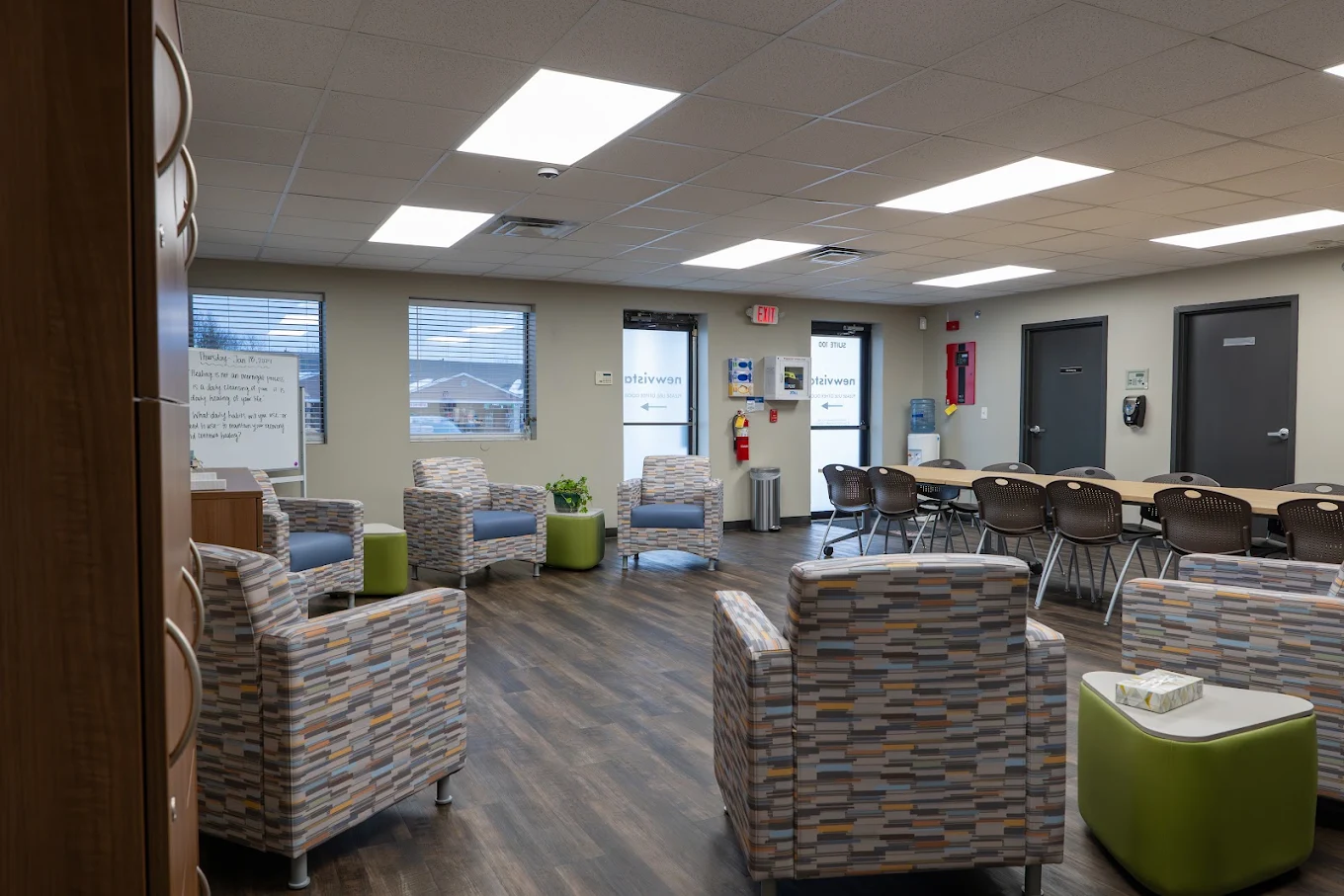 Common area with lounge chairs and group tables