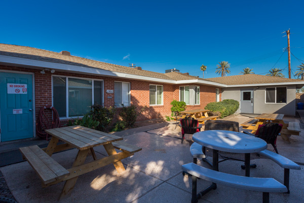 Outdoor courtyard with picnic tables and seating