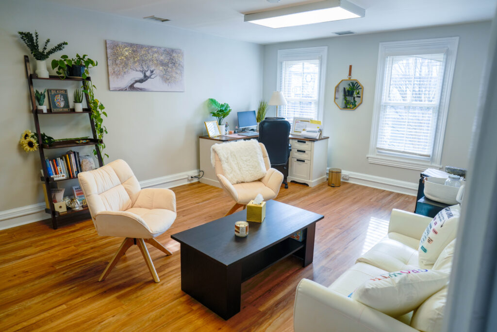 Cozy office with chairs, desk, and natural light