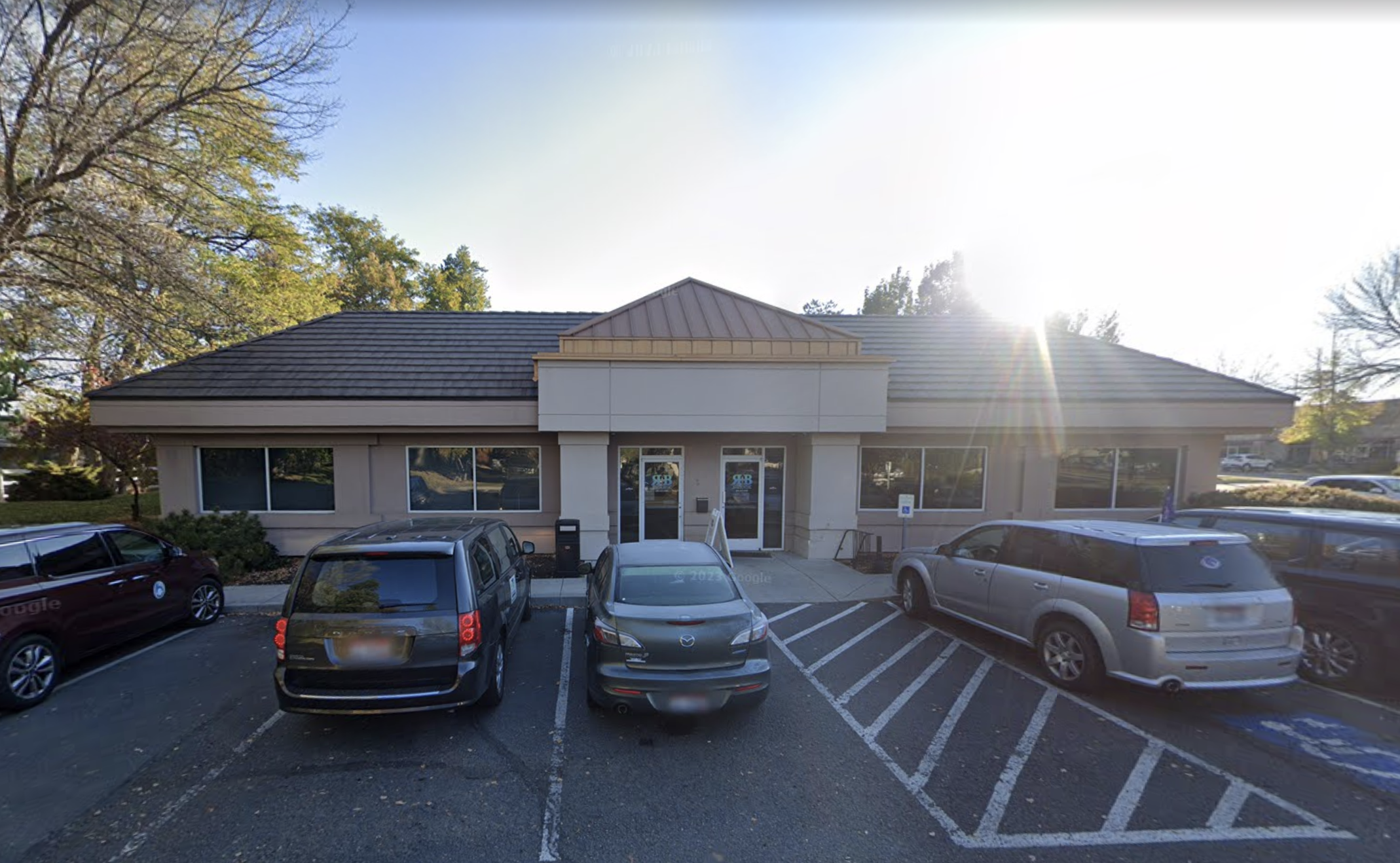 Front exterior of counseling office with parking spaces