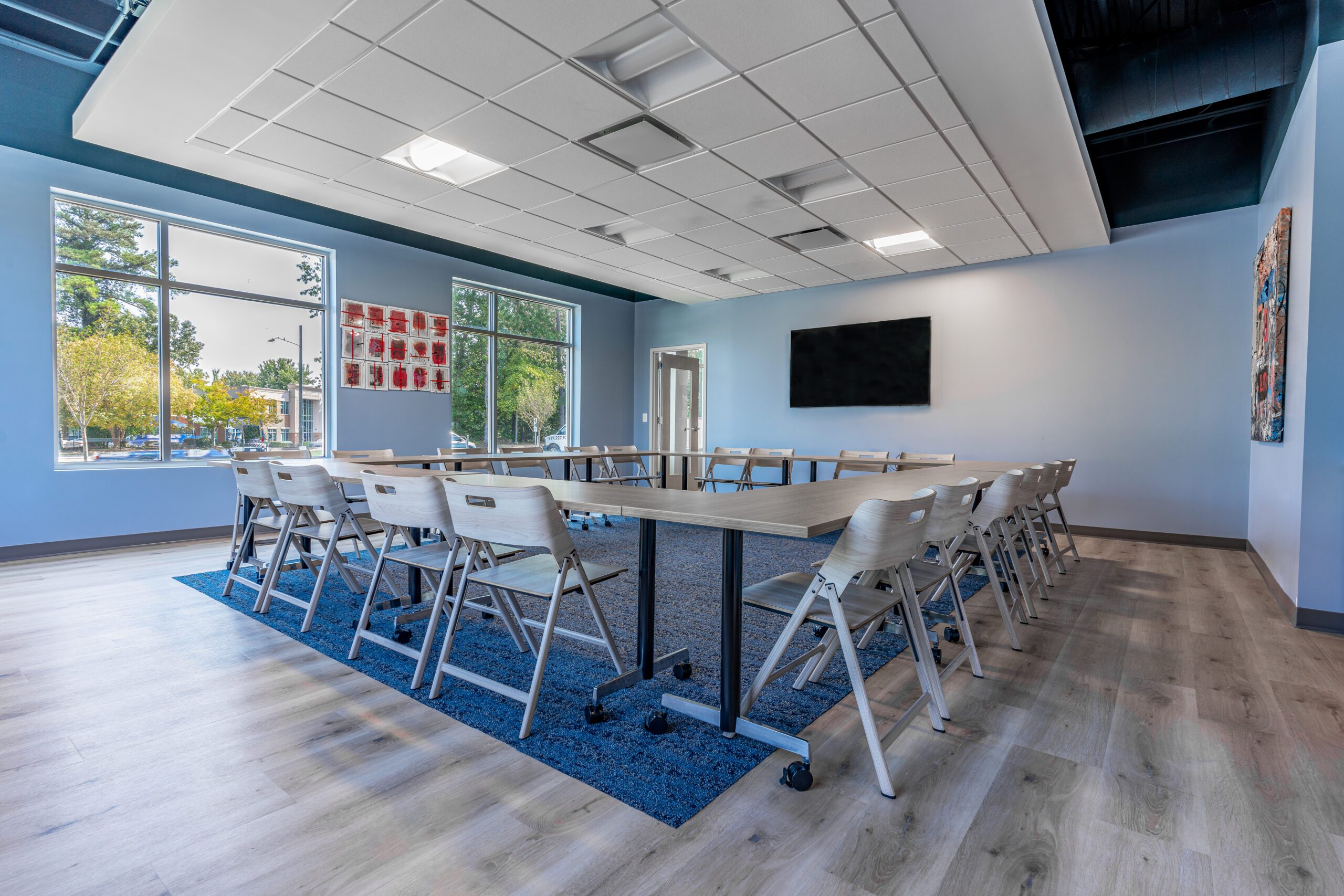 Group therapy room with conference tables and chairs