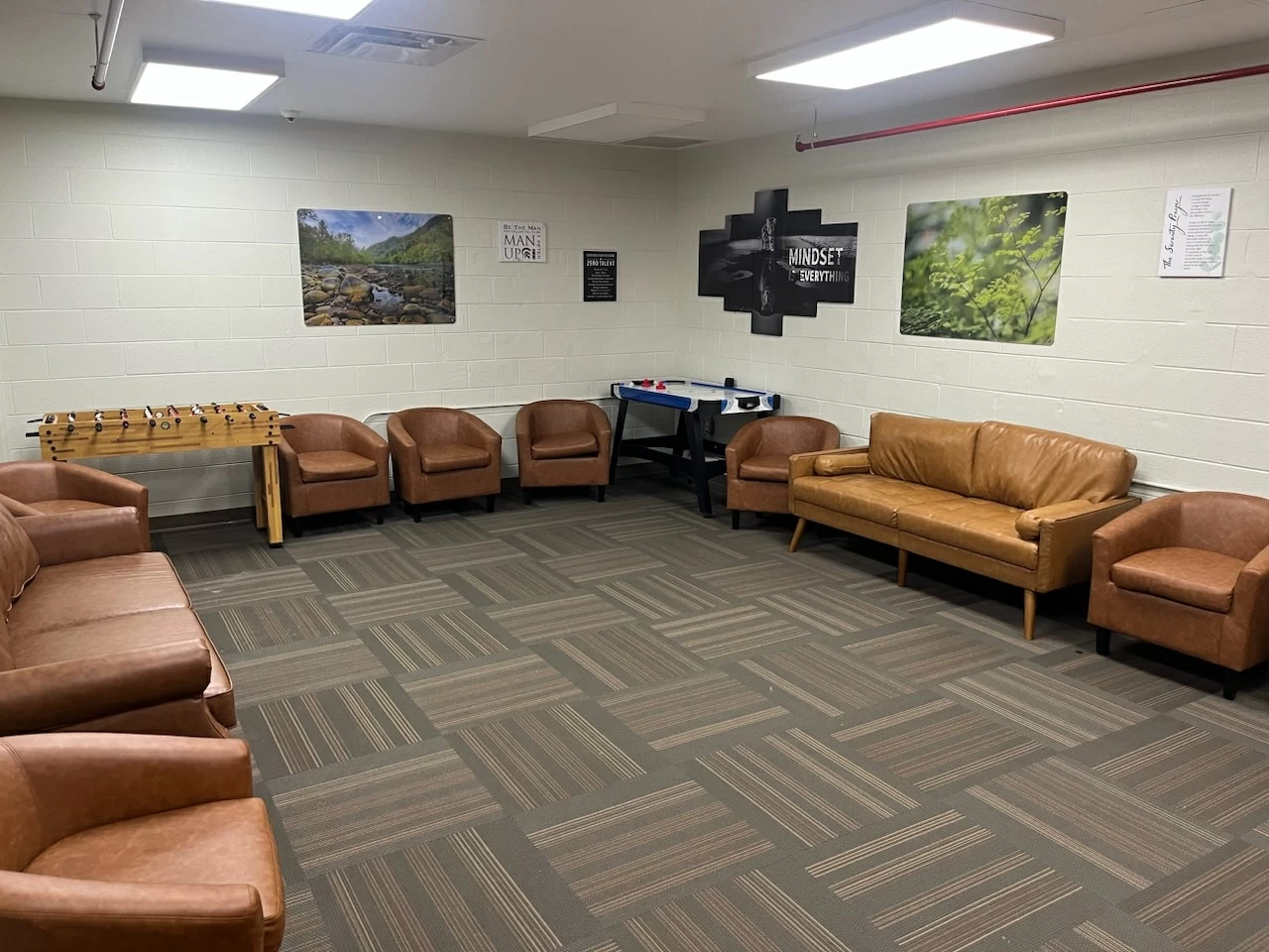 Lounge with couches and foosball and air hockey tables