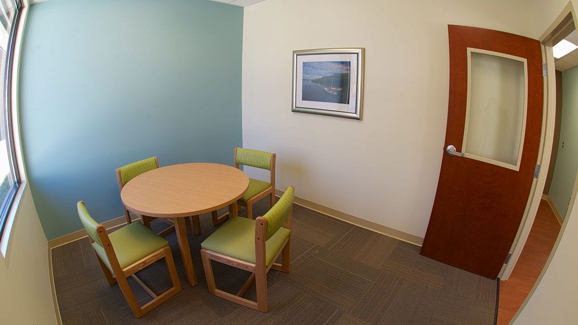 Private assessment room with table and chairs