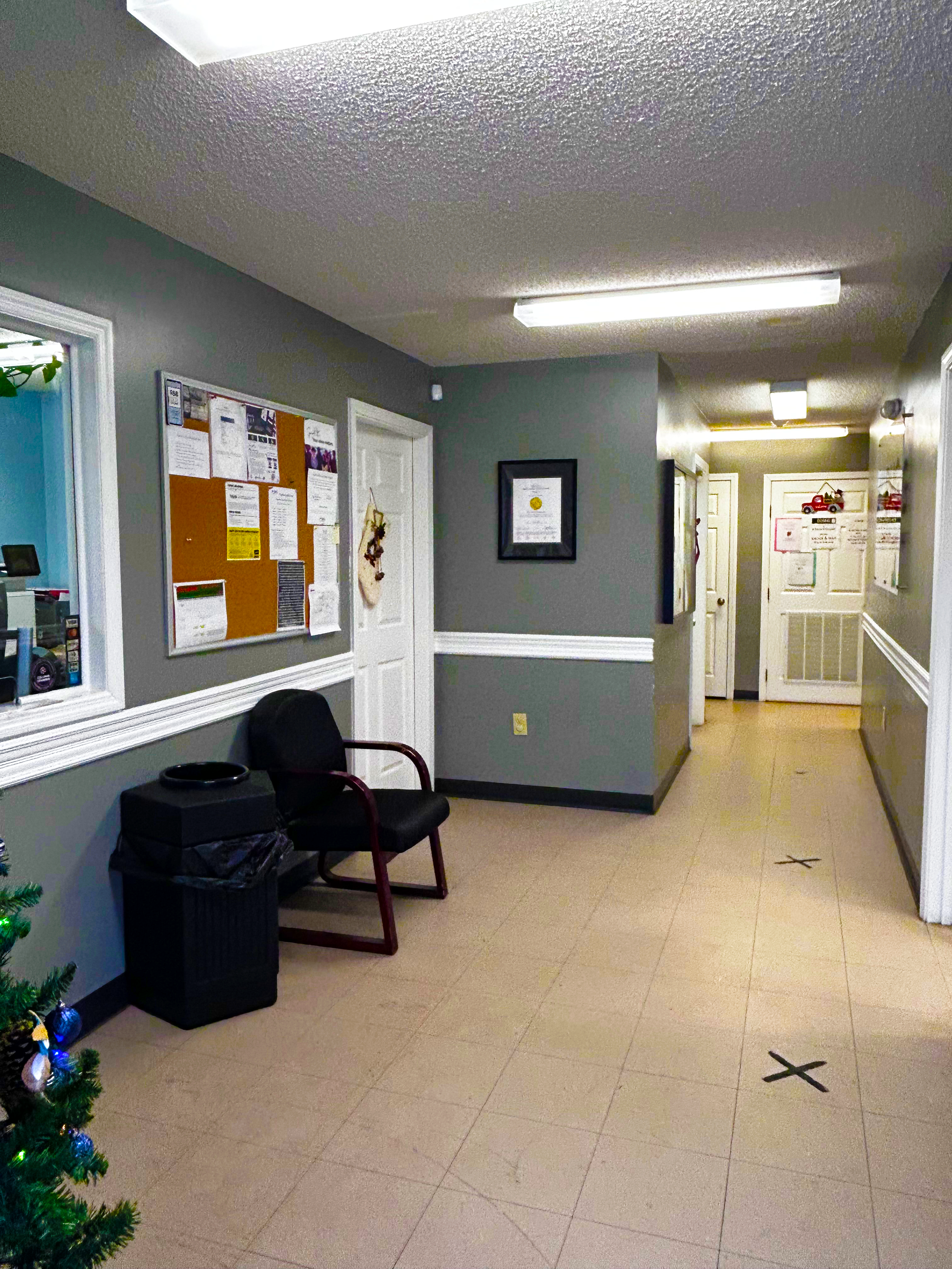 Lobby hallway with seating and information board