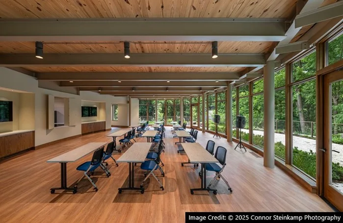 Meeting room with wood ceiling and forest view
