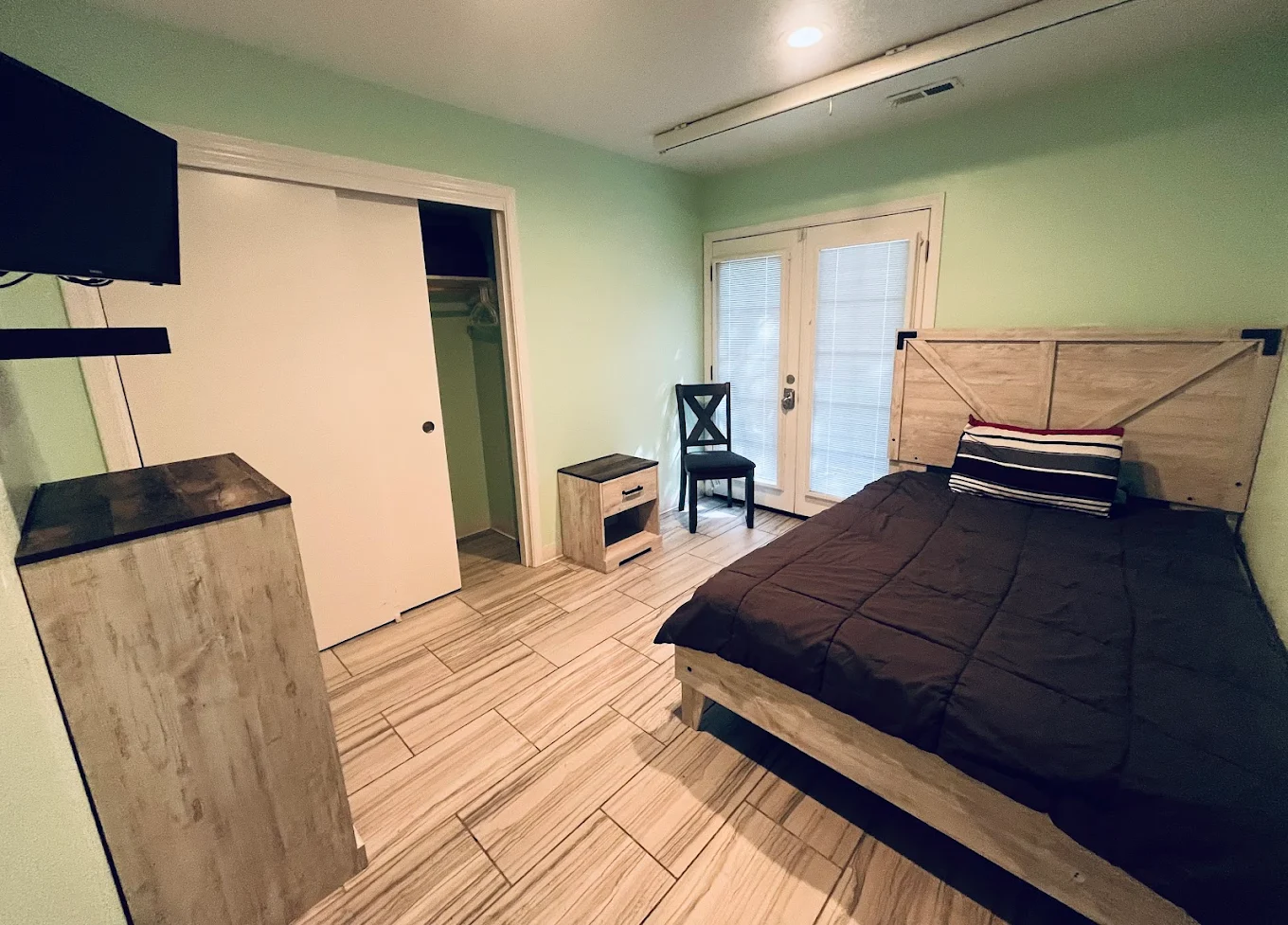 Private bedroom with bed and storage space