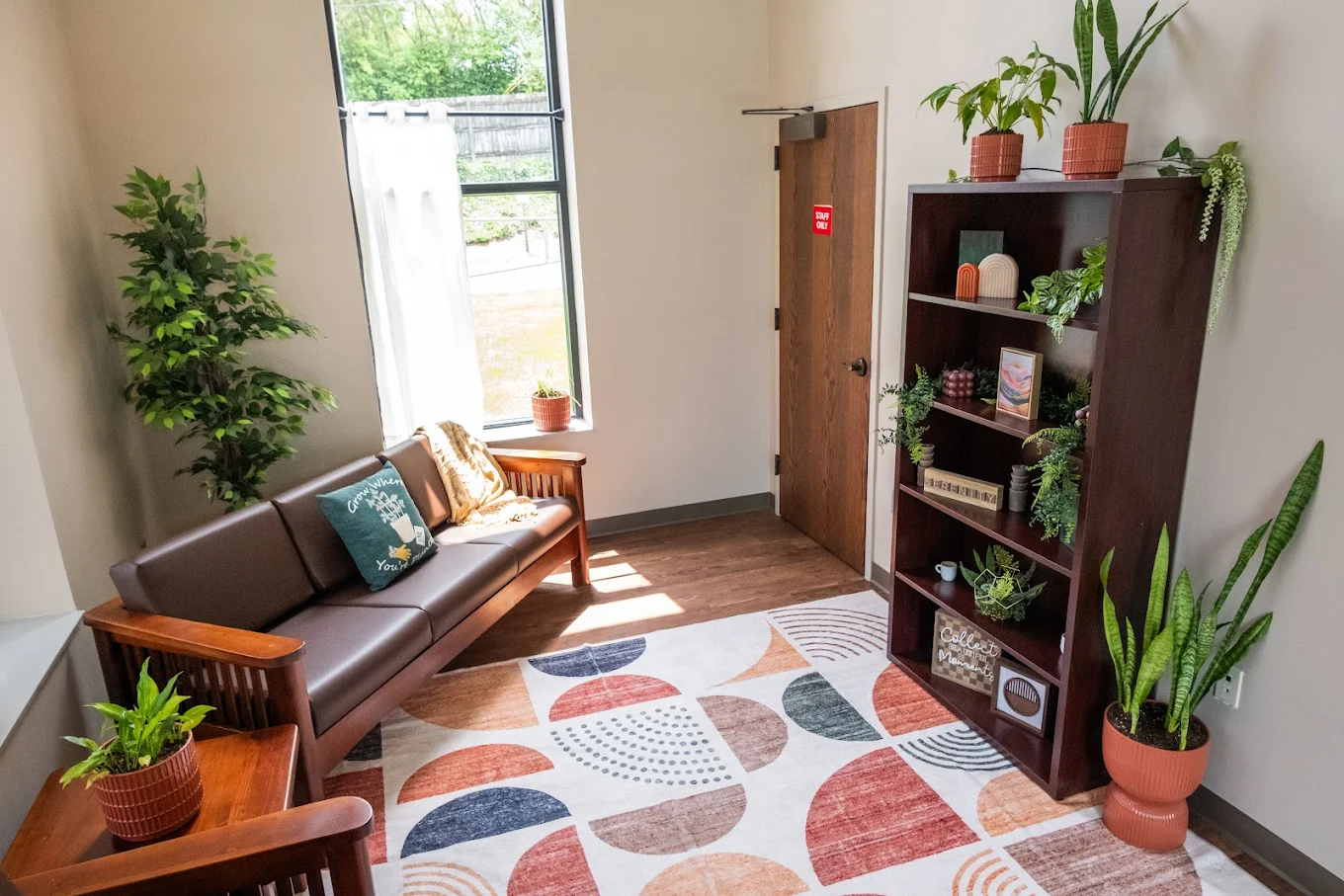 Bright waiting area with seating and indoor plants