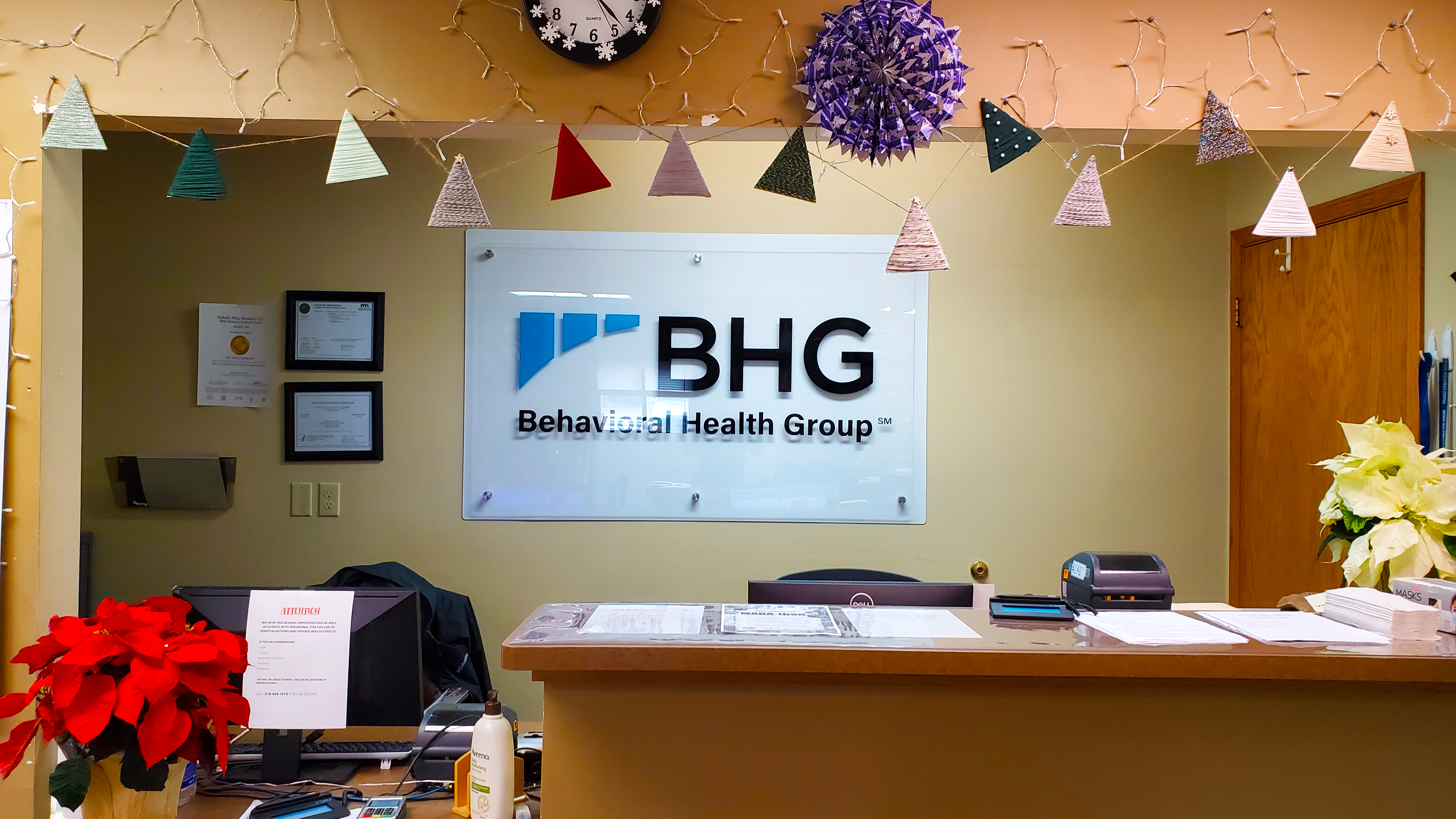 Reception desk with BHG logo in the lobby