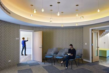 Bright meeting room with chairs and overhead lighting
