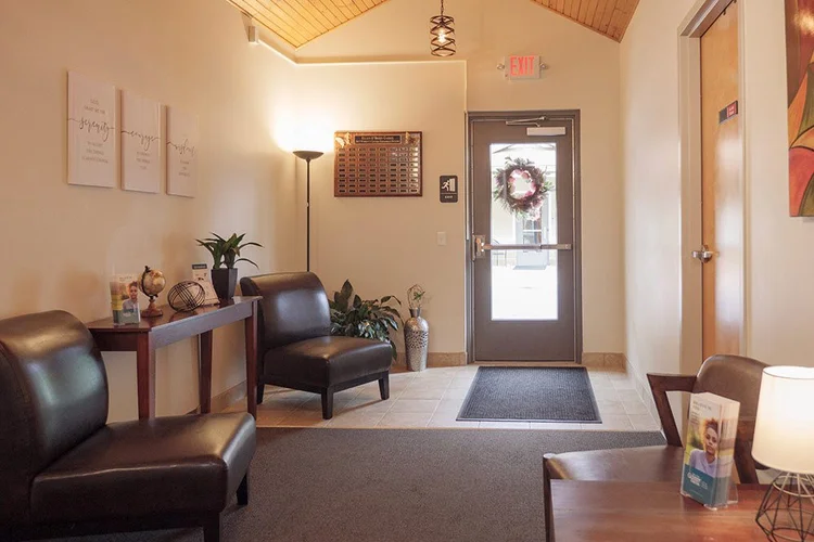 Lobby with chairs and glass entry door