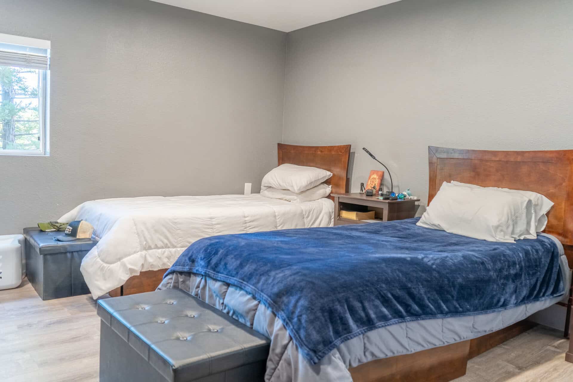 Bedroom with two beds and shared nightstand