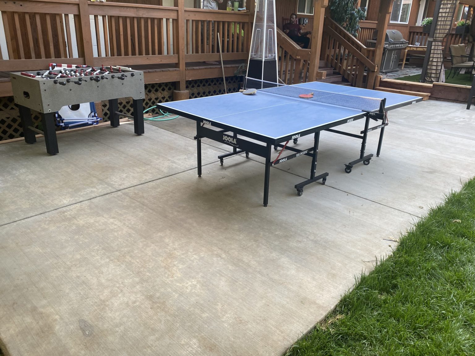 Outdoor recreation area with ping pong and foosball