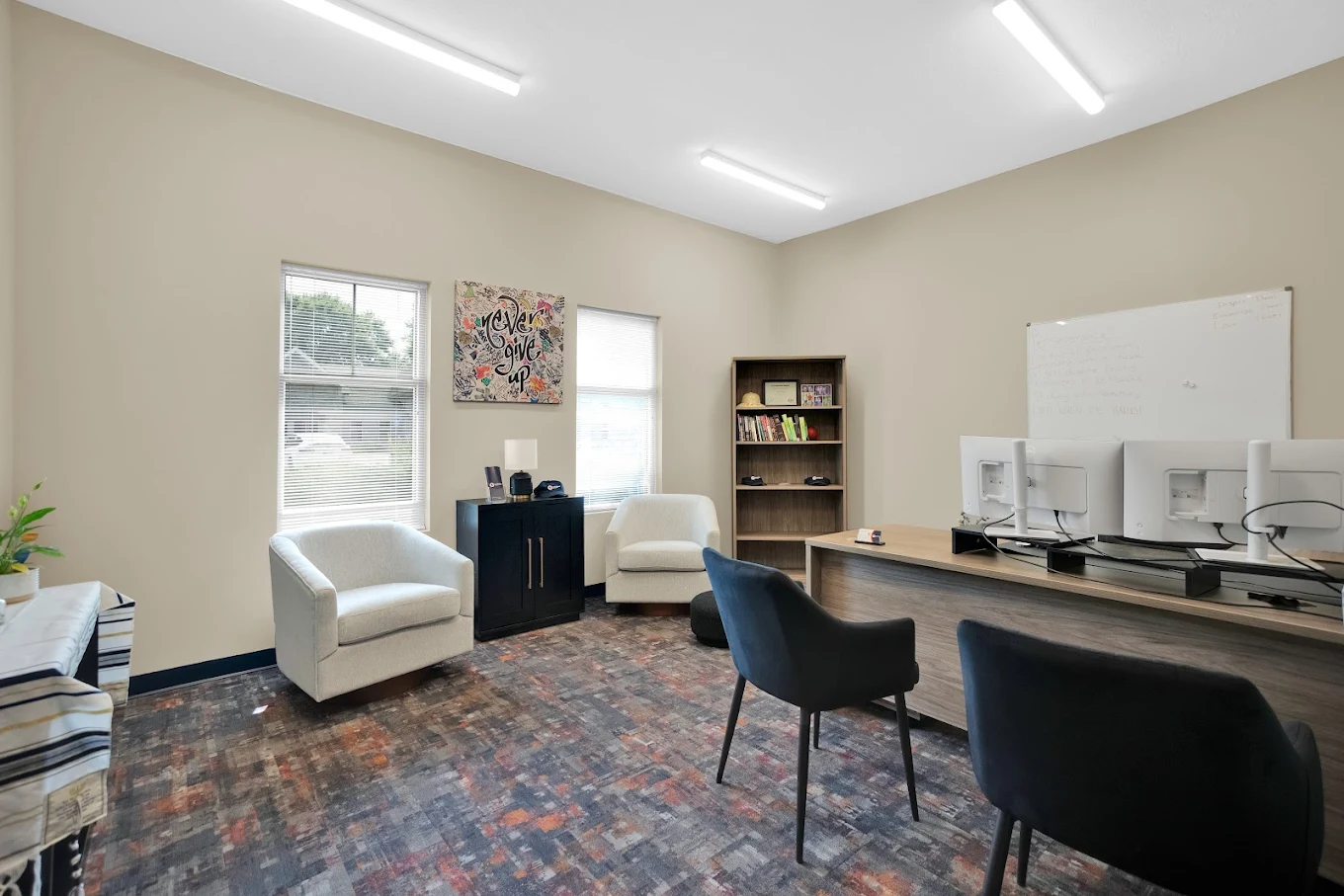 Counseling office with desk and seating area