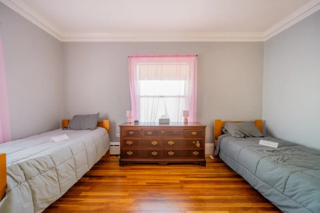 Shared bedroom with personal space and natural light