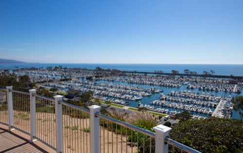 Scenic view of marina and ocean from hilltop