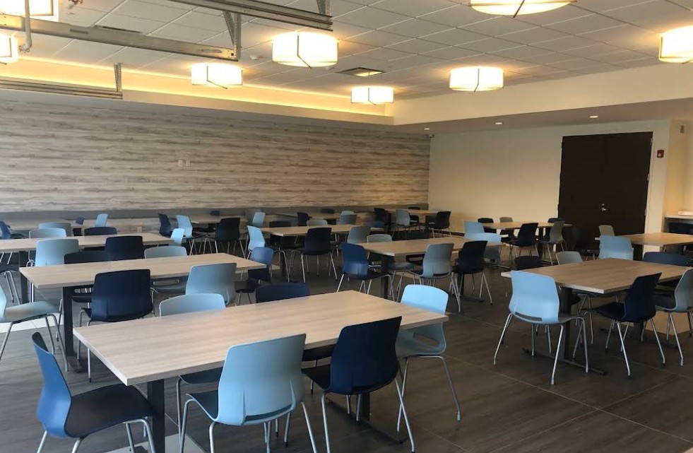 Community room with tables and chairs for group activities