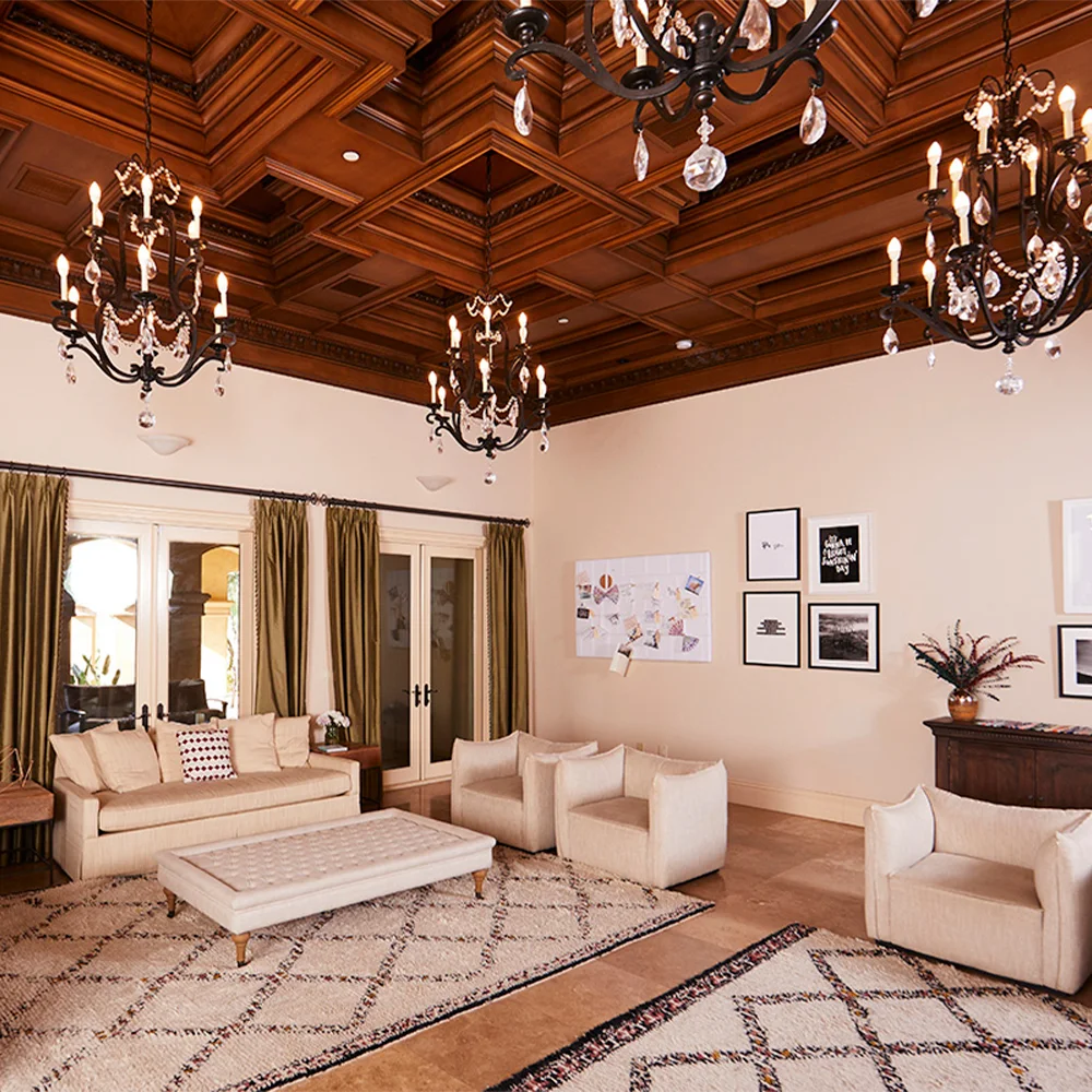 Elegant living room with chandeliers and sofas