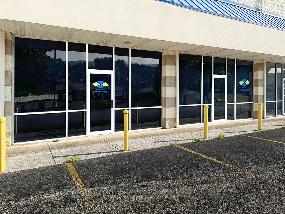 Crossroads treatment center storefront with glass doors and parking
