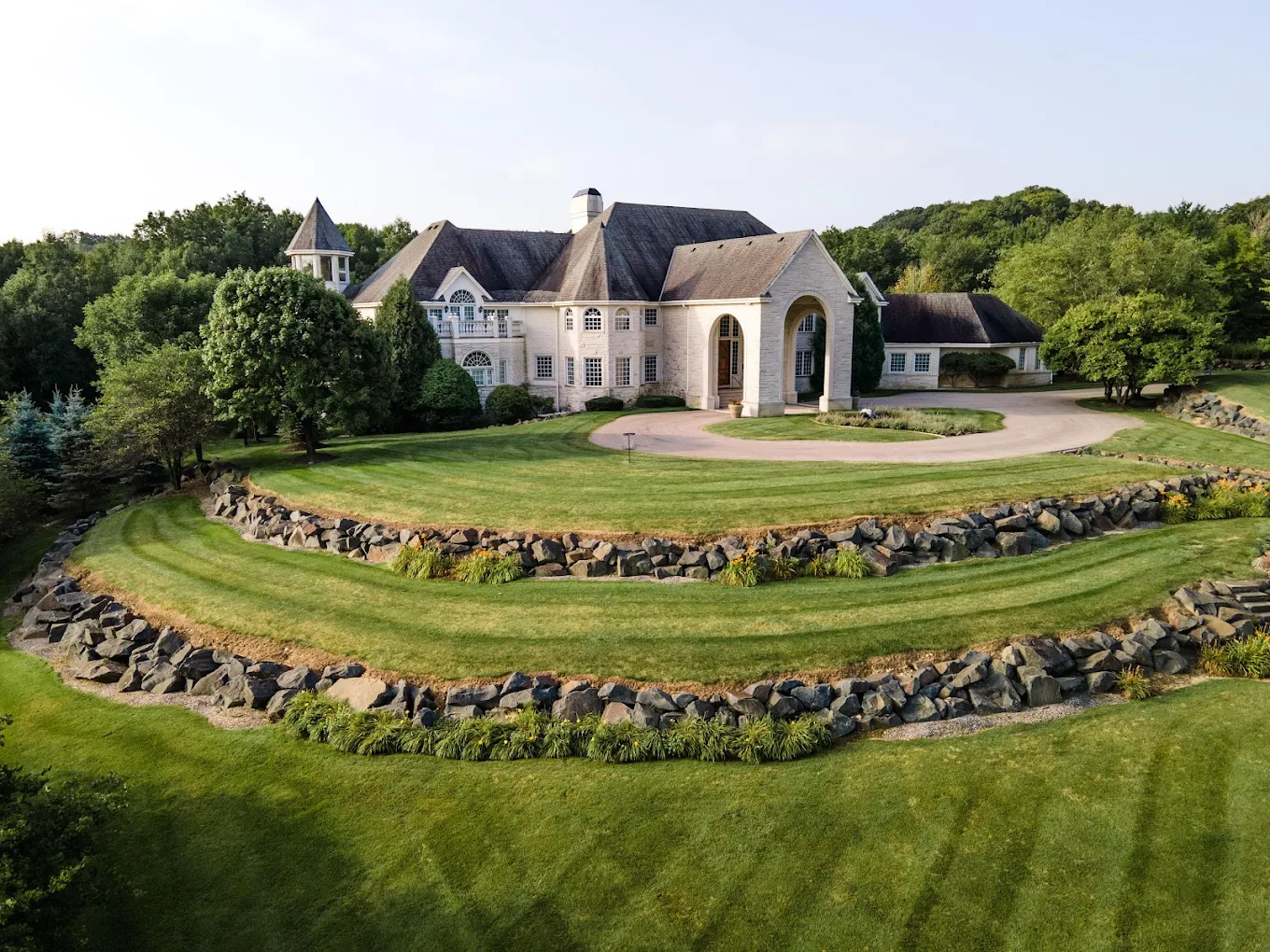 Facility sign in front of luxury rehab center entrance.