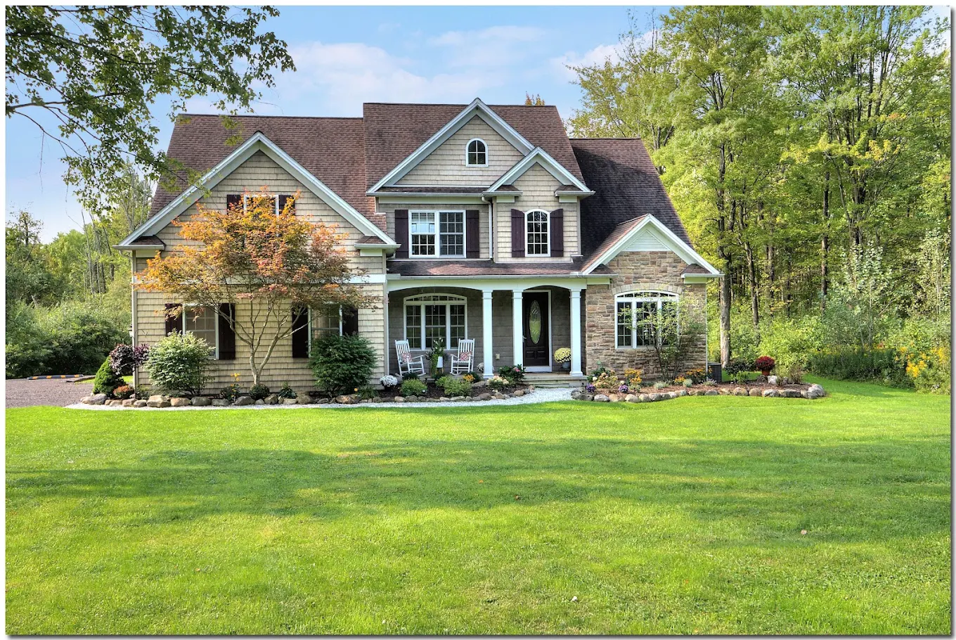Residential facility with large lawn and covered front porch