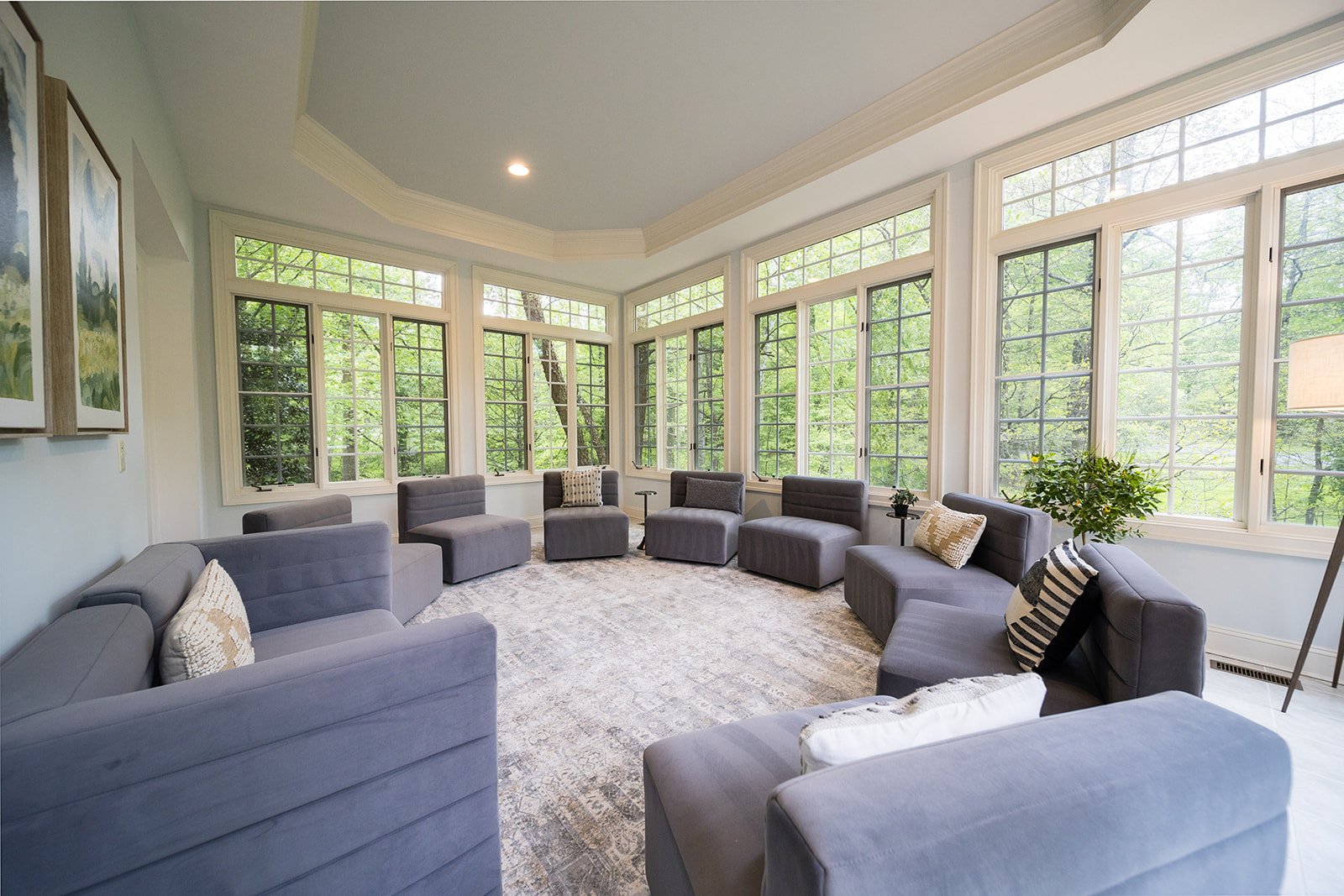 Circle of modern chairs in sunlit group therapy room