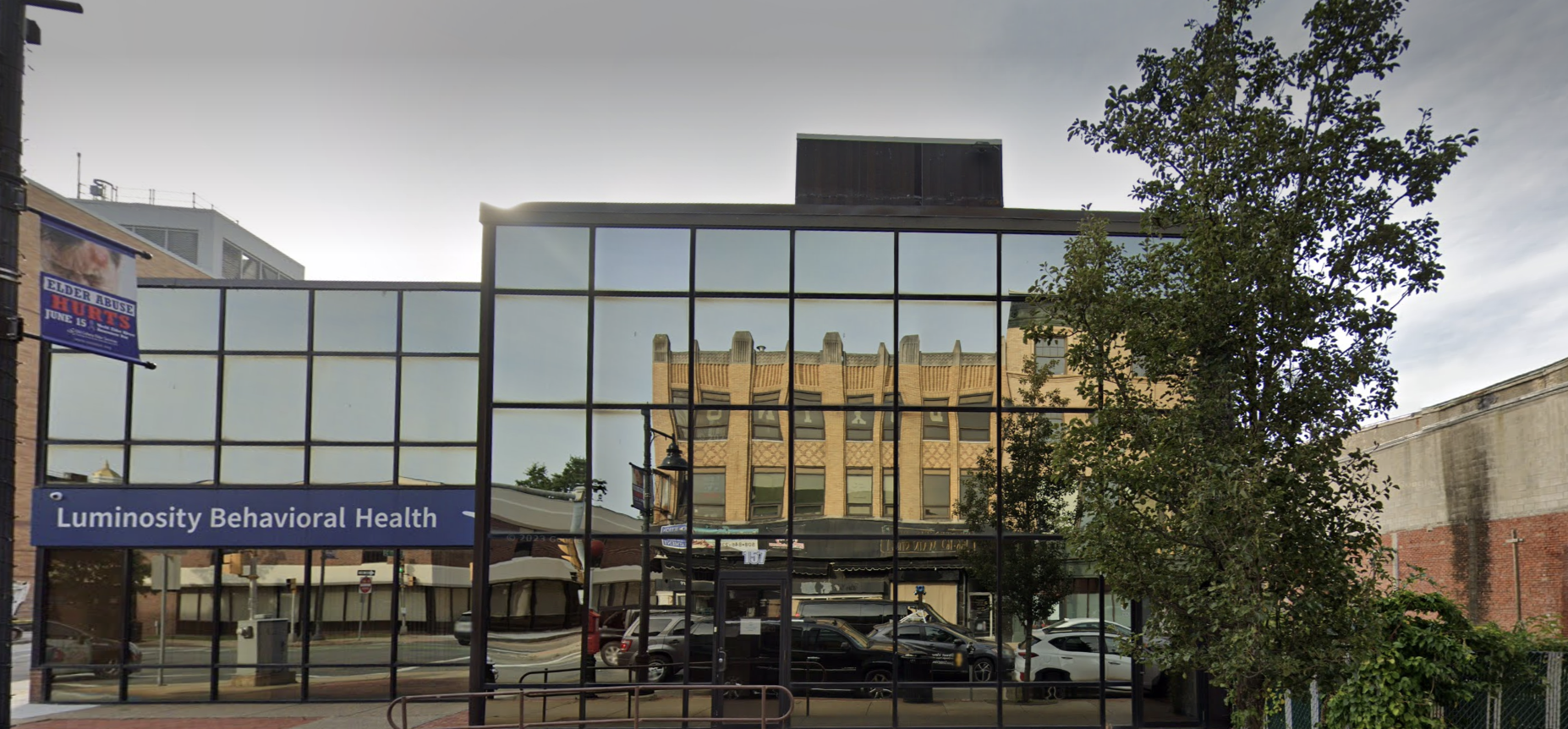 A modern behavioral health facility with reflective glass windows, offering a professional and inviting atmosphere.