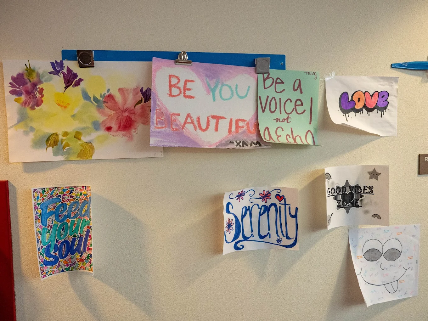 Colorful mural depicting an abstract forest with sunlight