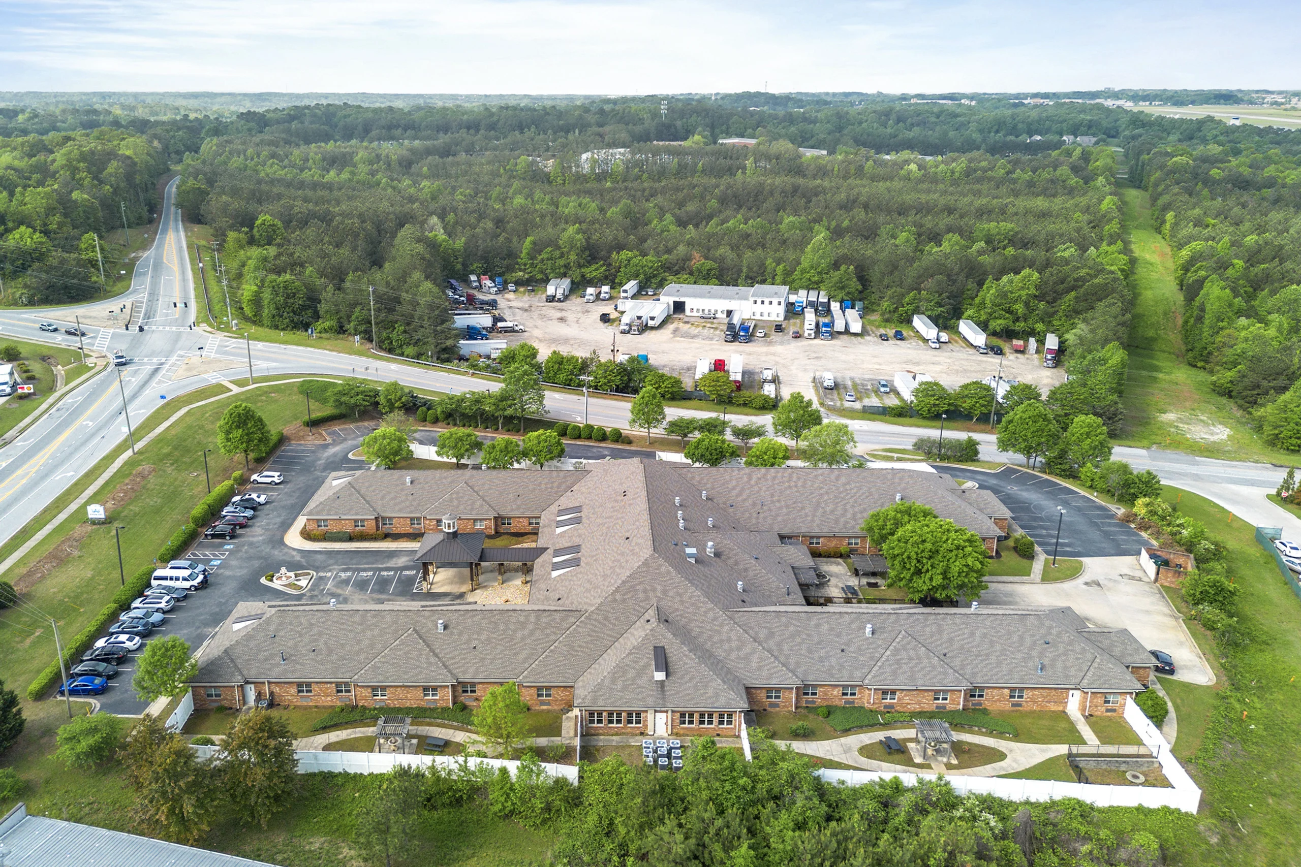 Aerial view of the Promises Atlanta campus surrounded by wooded landscapes and expansive grounds in Dacula, Georgia
