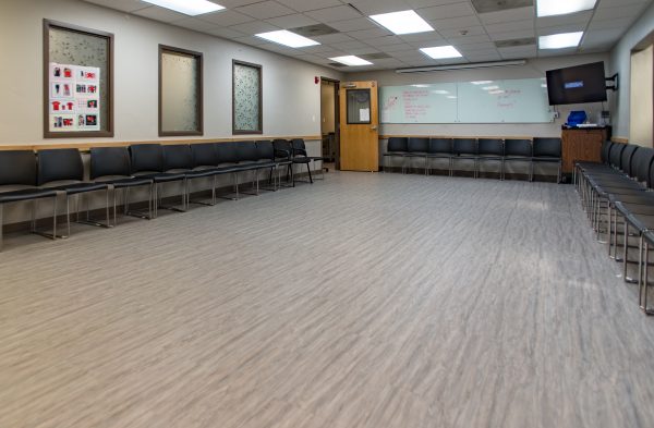 Spacious room with black chairs arranged in a circle