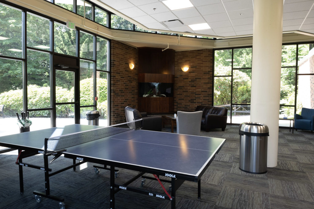 Recreation room with ping pong table and lounge seating