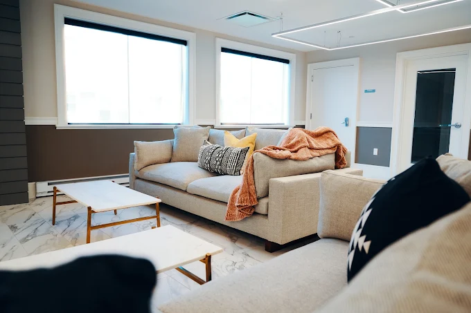 Comfortable sofa seating area with large windows