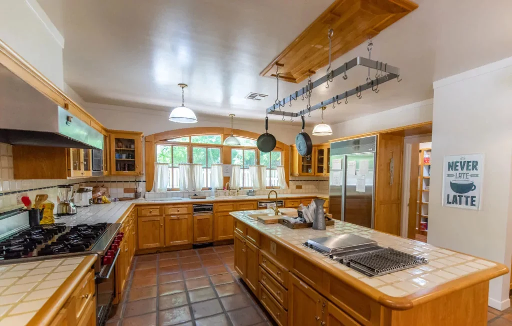 Spacious kitchen with island and stainless appliances