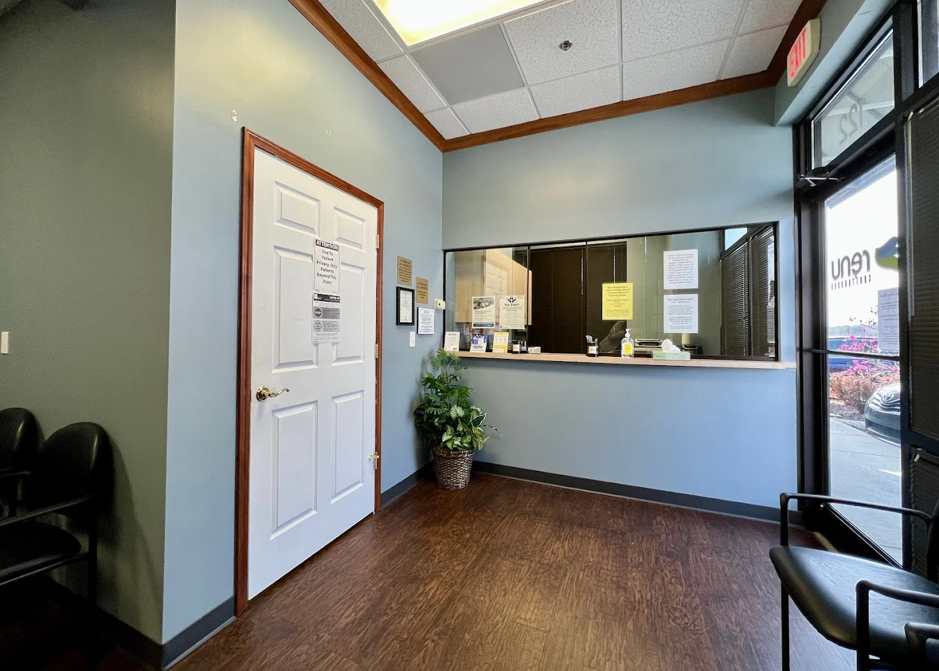 Reception area with check-in window and seating