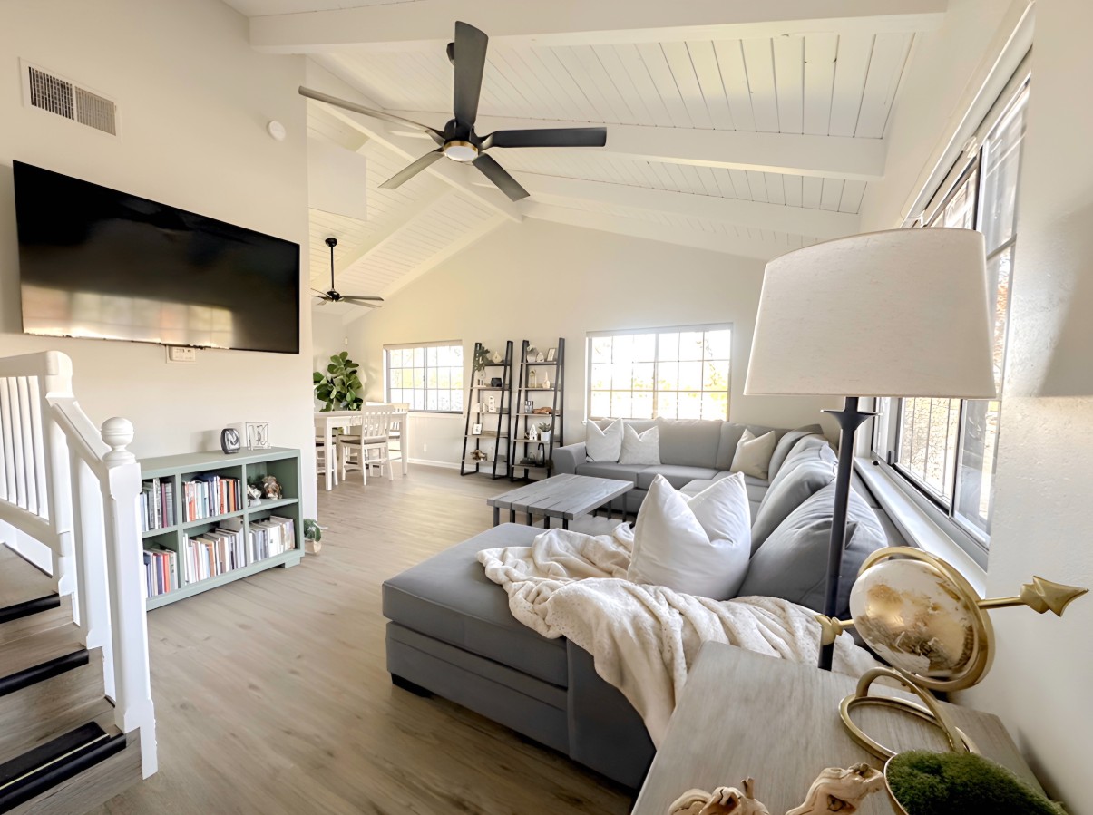 Bright living room with sectional sofa and dining area