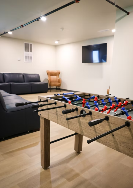Foosball table with leather seating and TV