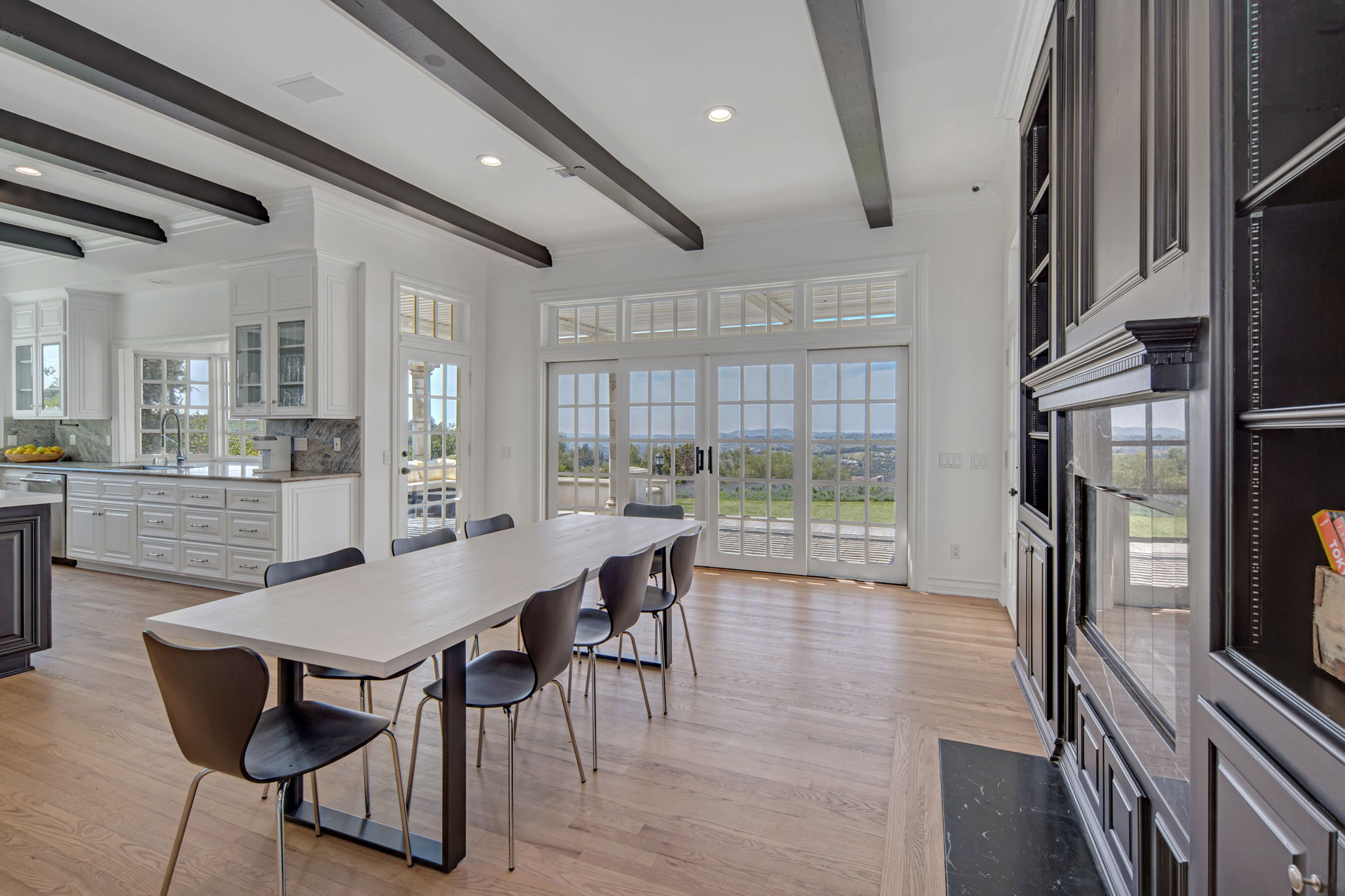 Dining table near kitchen with scenic outdoor views