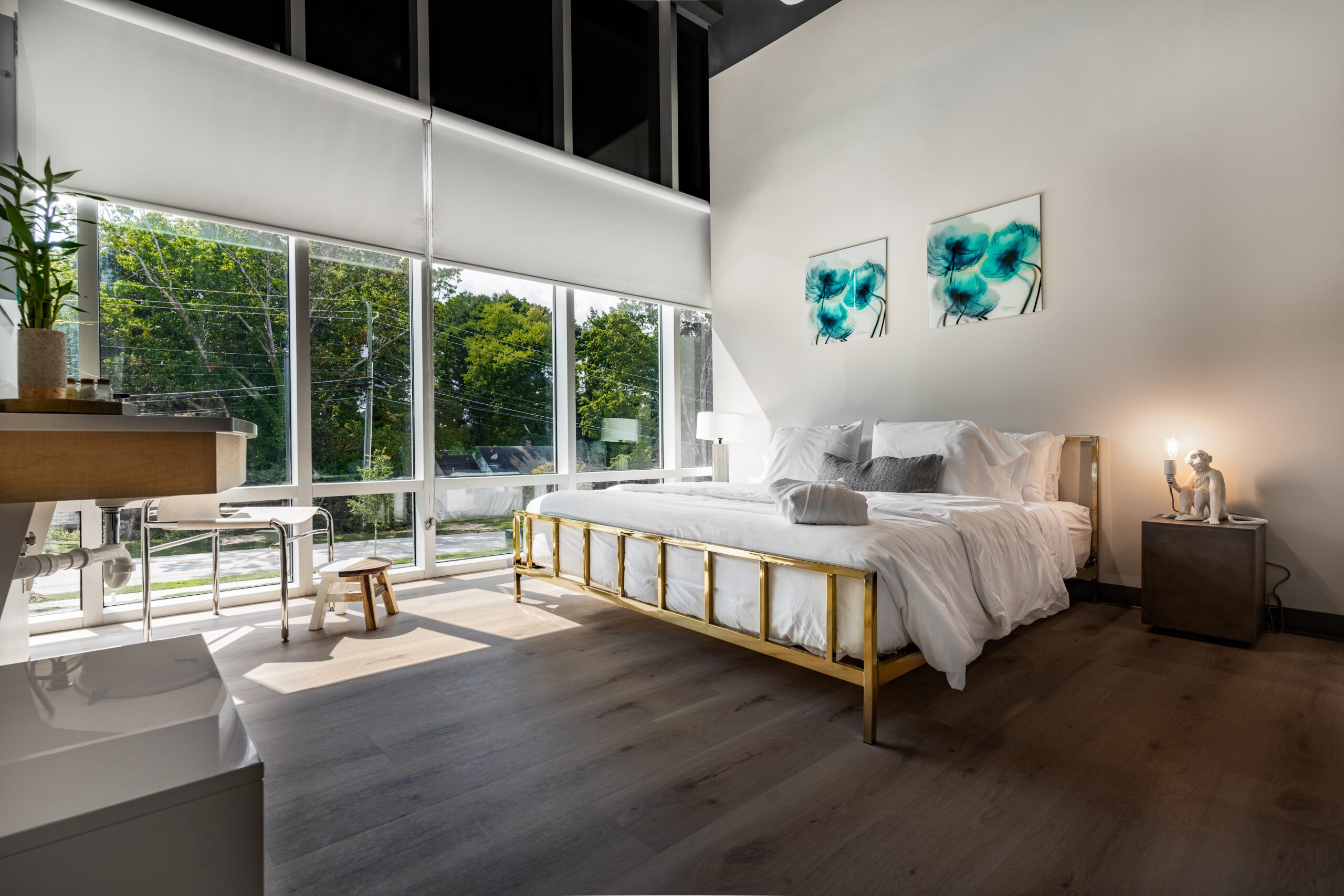 Luxury bedroom with king bed and floor-to-ceiling windows