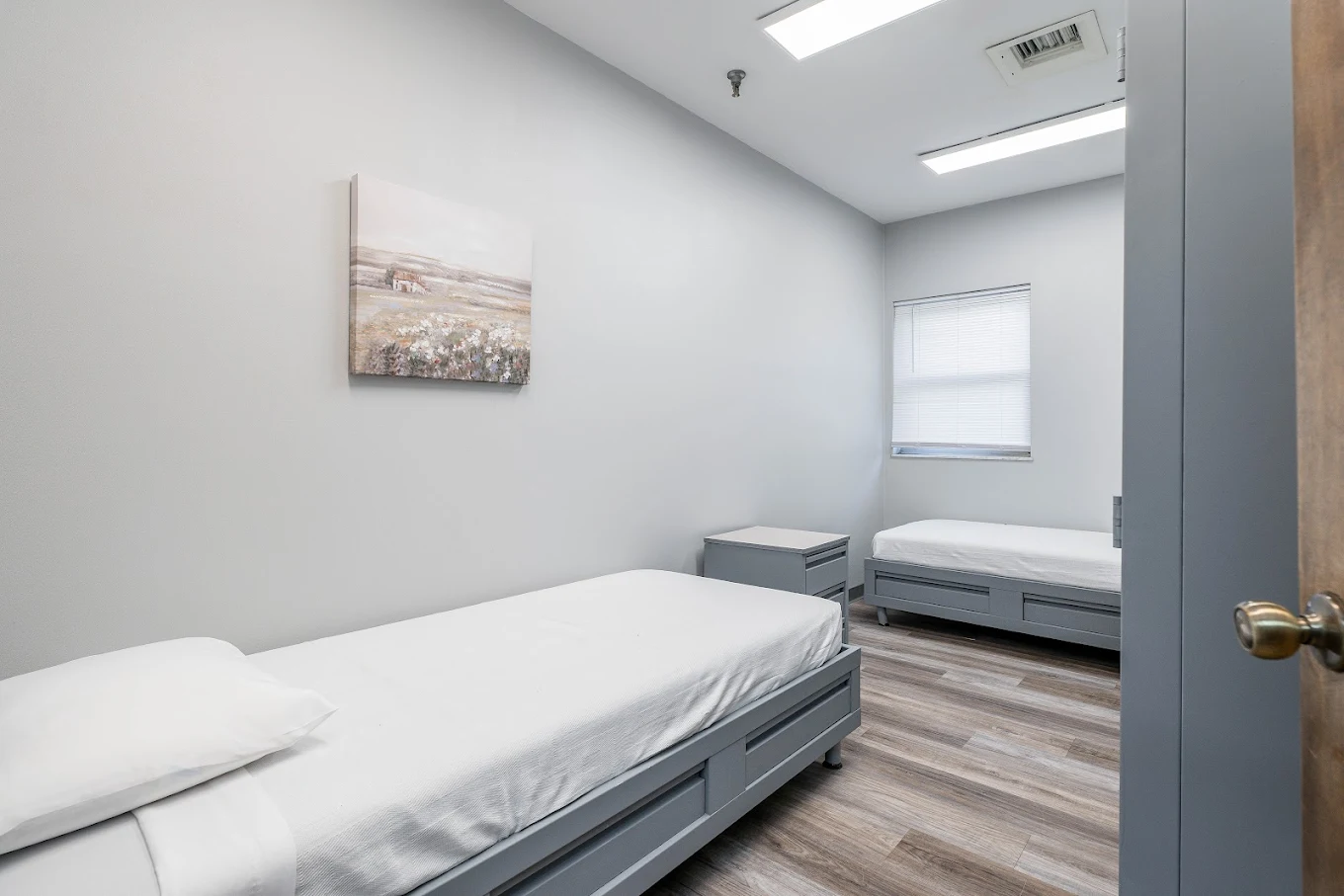 Shared bedroom with two single beds and window