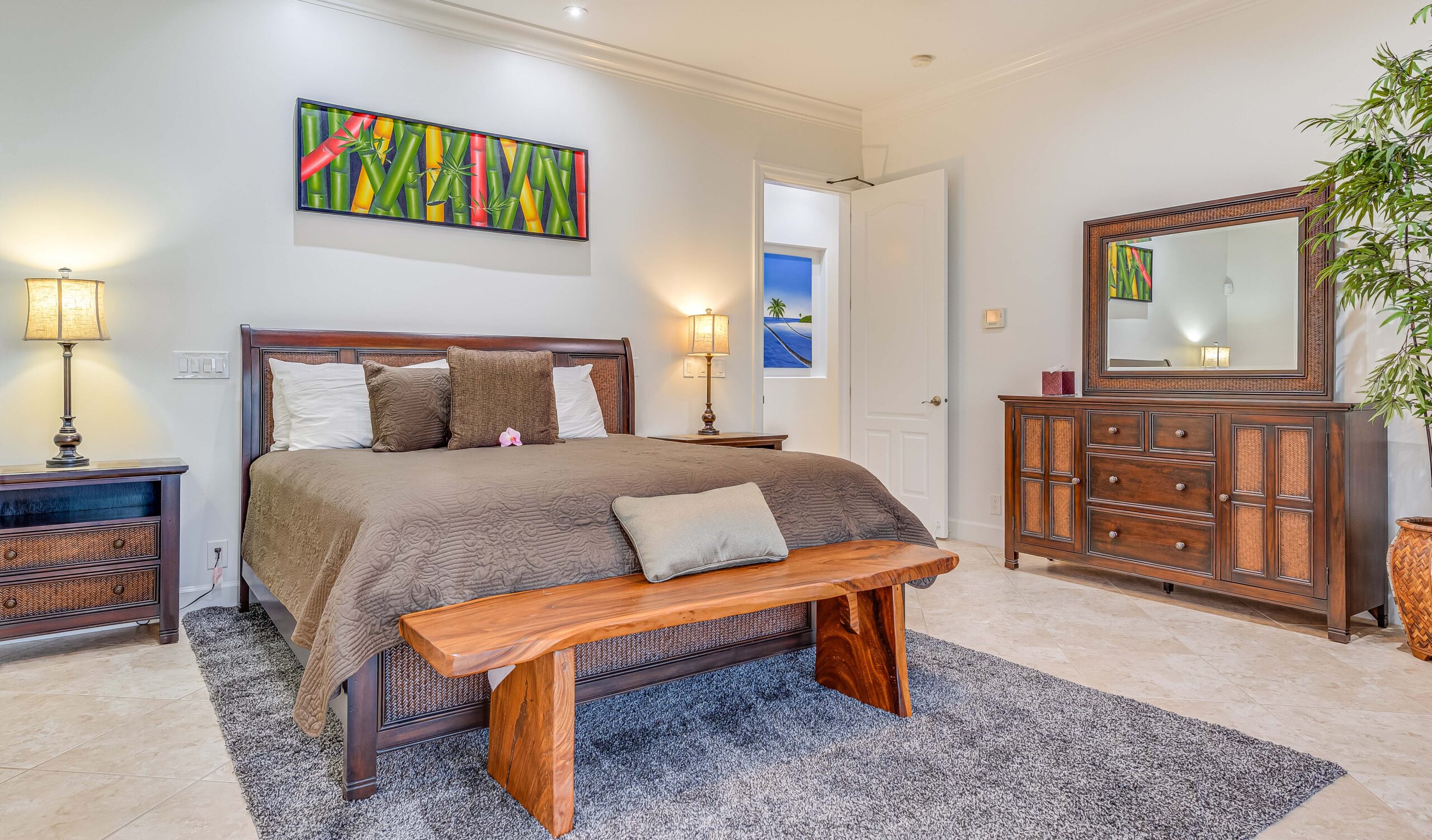 Spacious private bedroom with king-size bed, seating area, and upscale furnishings