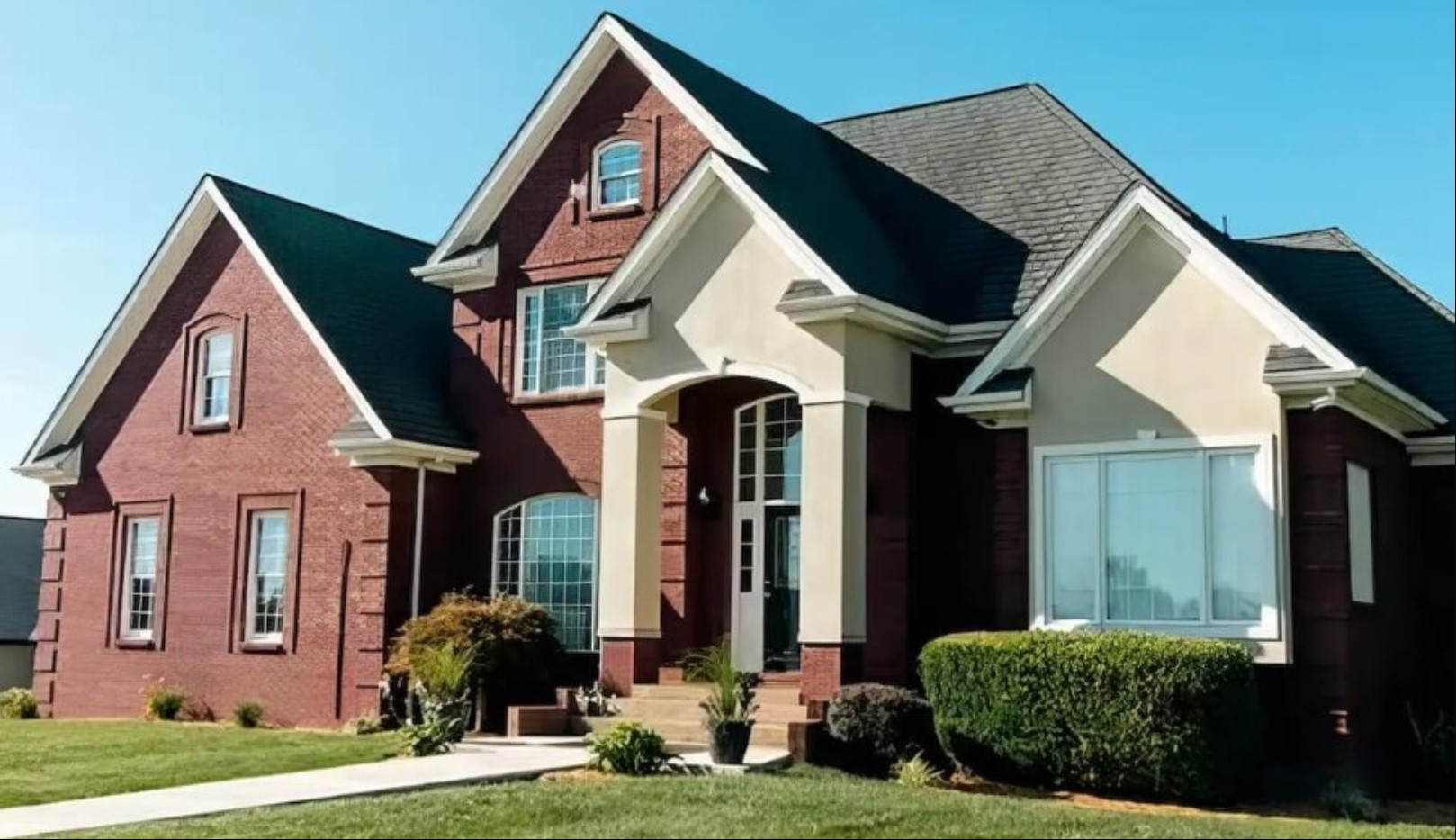 Exterior view of the facility entrance and lawn pathway.
