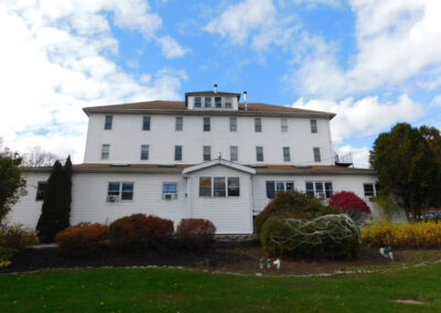 Front view of large white residential facility building