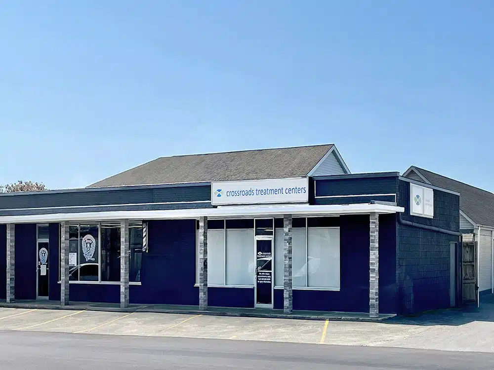 Clinic building with Crossroads sign and parking spaces
