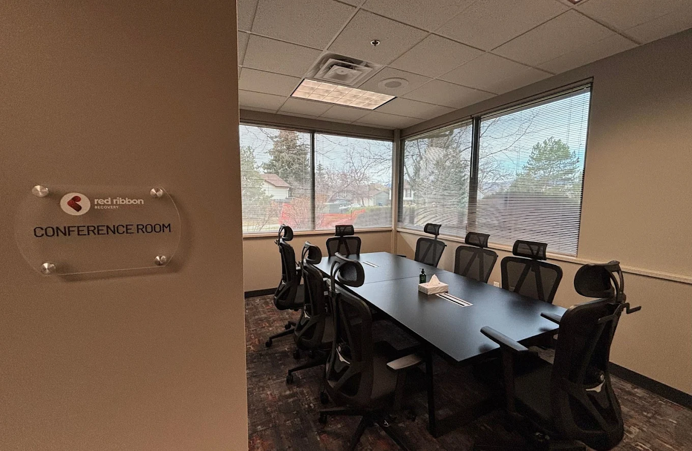 Conference room with table and office chairs