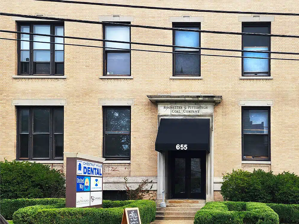 Brick building exterior with entrance at 655 Walnut Street