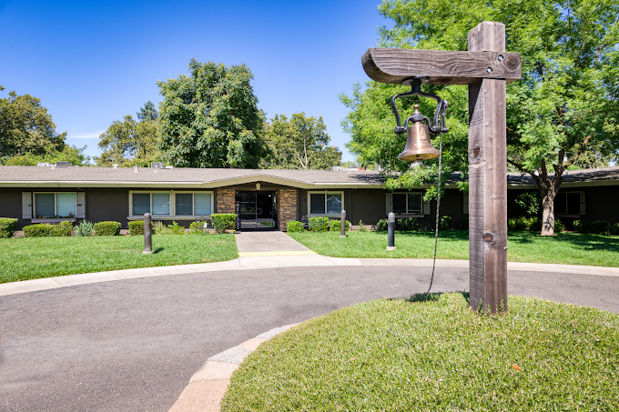 Front entrance with circular drive and landscaped grounds